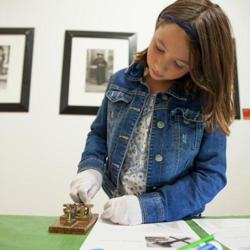 Girl with museum tool
