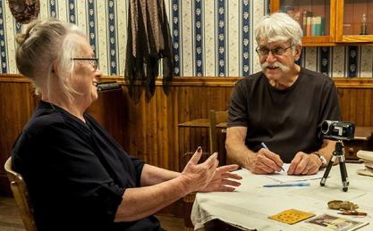 Two people talking at a table