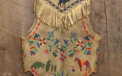 old decorative deerskin vest